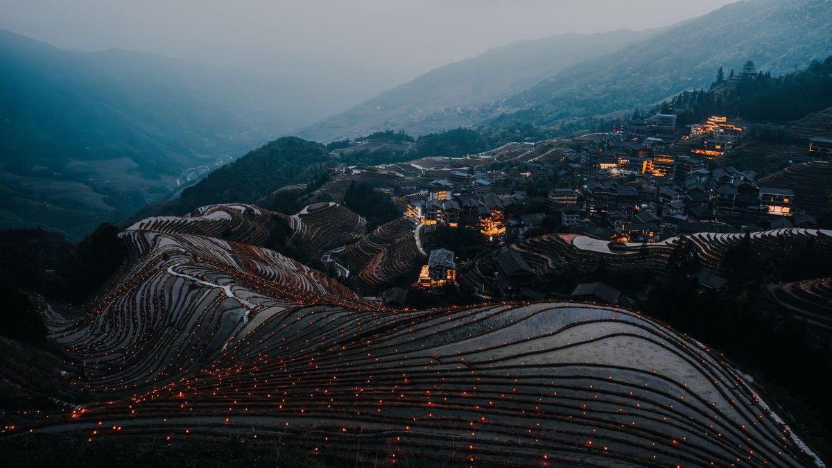 Aerial view of karst limestone peaks rising from the Li River valley near Guilin China shrouded in morning mist