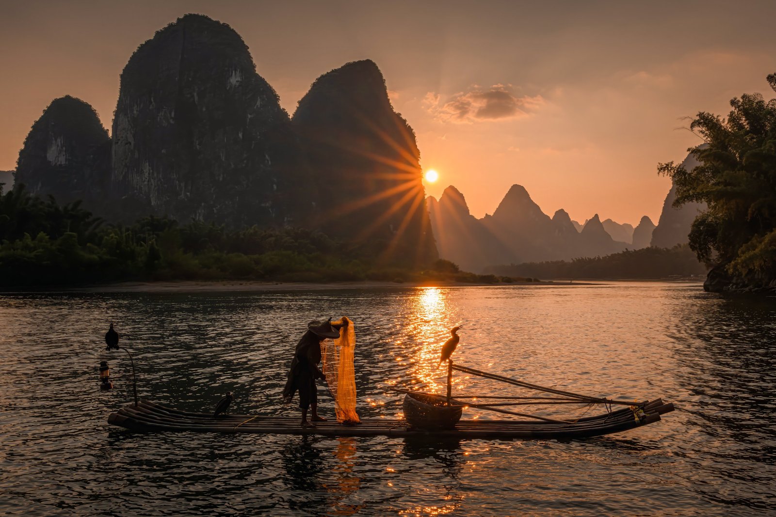 Cormorant fisherman at sunset on the Li River