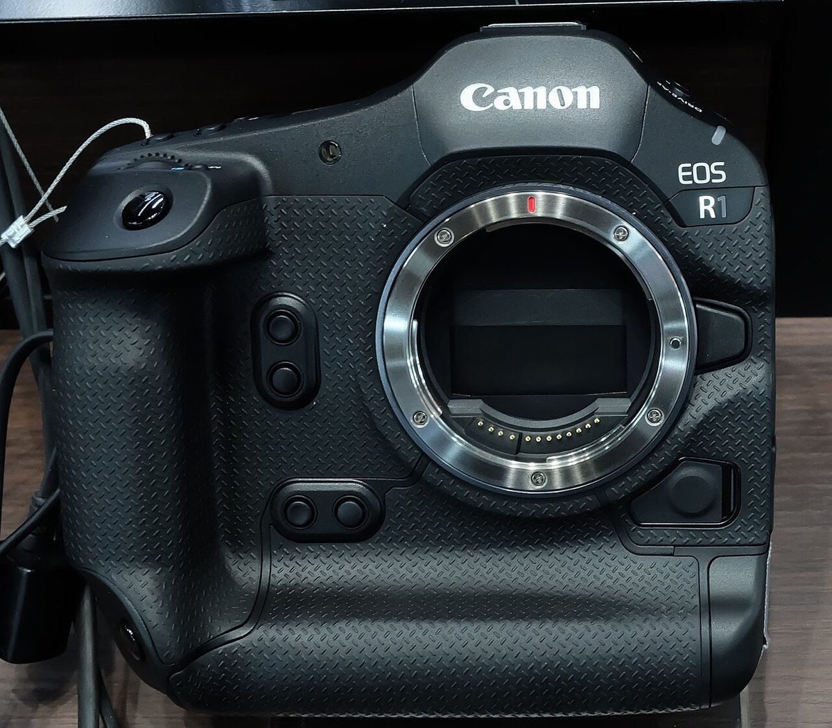 Canon EOS R1 mirrorless camera body showing RF mount and integrated grip