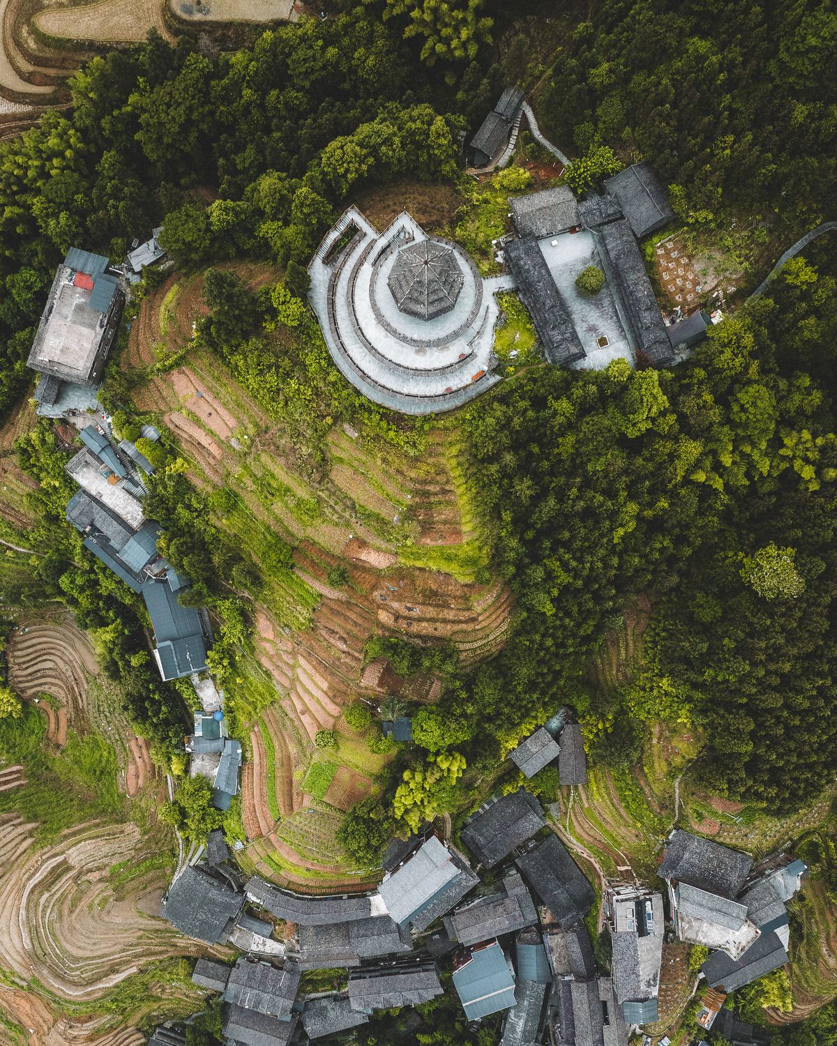 Traditional cormorant fisherman on a bamboo raft with lanterns on the Li River at dusk