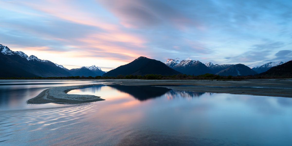 Lake Wakatipu reflections with mountains in soft evening light near Queenstown